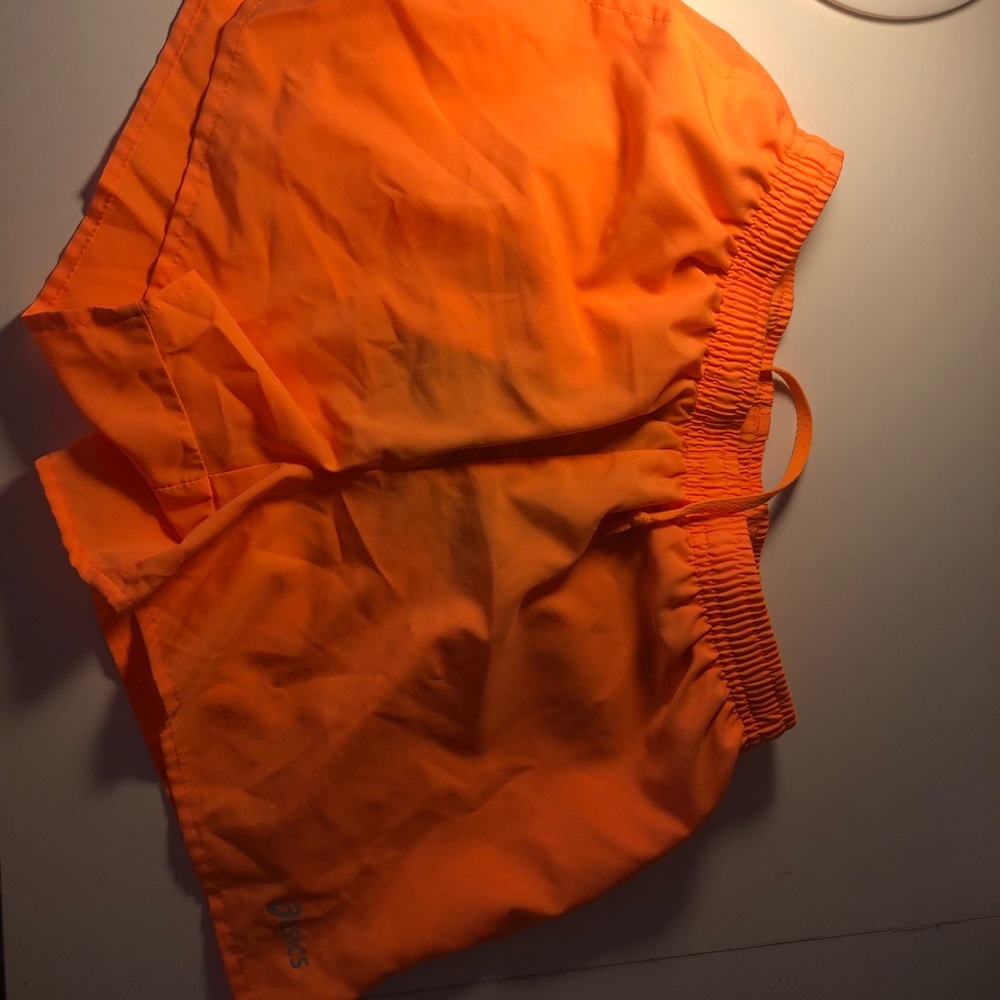 Orange Asics shorts